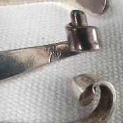 Portes couteaux forme vague rouleau créateur en métal argenté